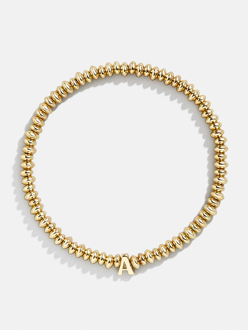 BaubleBar A - Gold beaded stretch bracelet