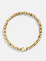 BaubleBar Q - Gold beaded stretch bracelet
