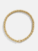 BaubleBar Y - Gold beaded stretch bracelet