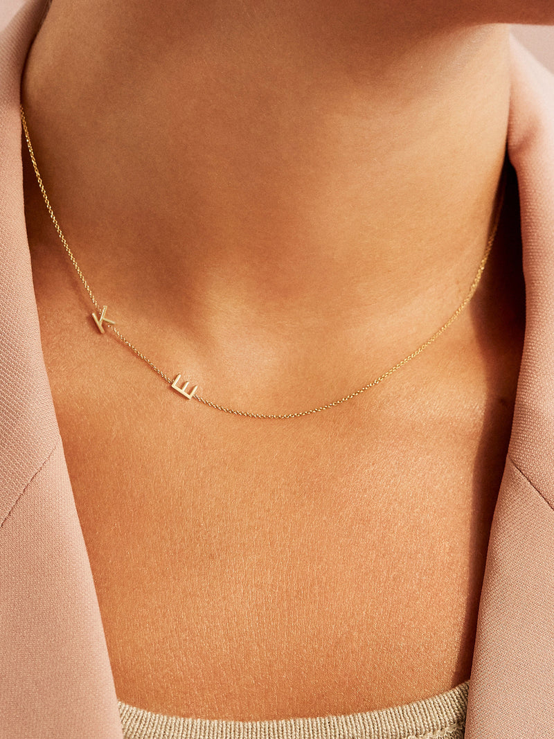 BaubleBar Maya Brenner Asymmetrical Custom Initial Necklace - Double Letter - 
    Solid White Gold, Rose Gold, or Yellow Gold
  
