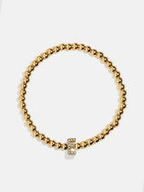 BaubleBar E - 
    Gold beaded stretch bracelet
  
