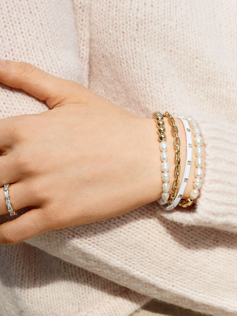 BaubleBar Perlita Pisa Bracelet - Pearl - 
    Gold and pearl beaded stretch bracelet - Also offered in small wrist sizes
  
