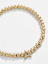 BaubleBar Initial Pisa Bracelet - Gold Twist - 
    Gold beaded stretch bracelet
  
