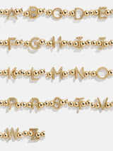 BaubleBar Initial Pisa Bracelet - Gold Twist - 
    Gold beaded stretch bracelet
  
