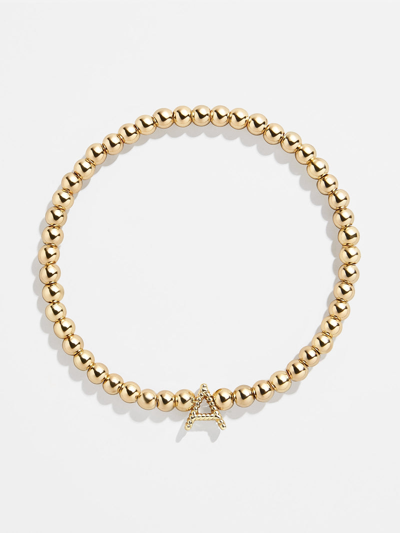 BaubleBar Gold / A - 
    Gold beaded stretch bracelet
  
