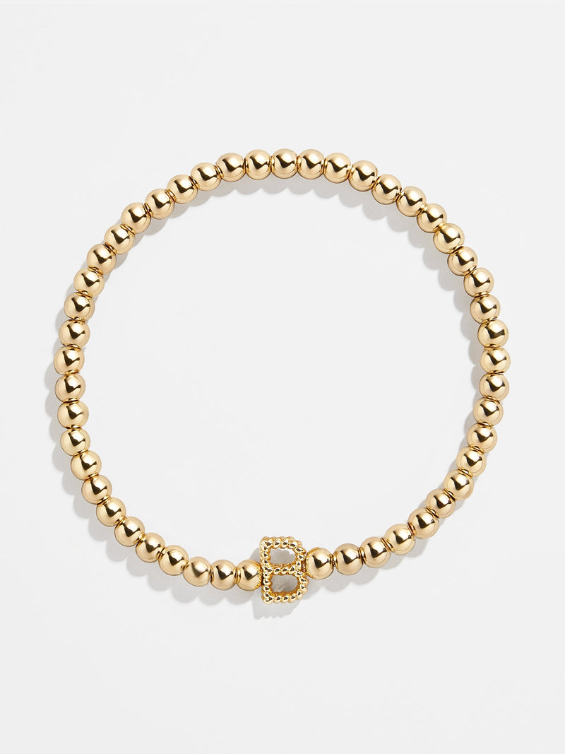 BaubleBar B - 
    Gold beaded stretch bracelet
  
