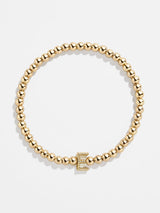 BaubleBar E - 
    Gold beaded stretch bracelet
  
