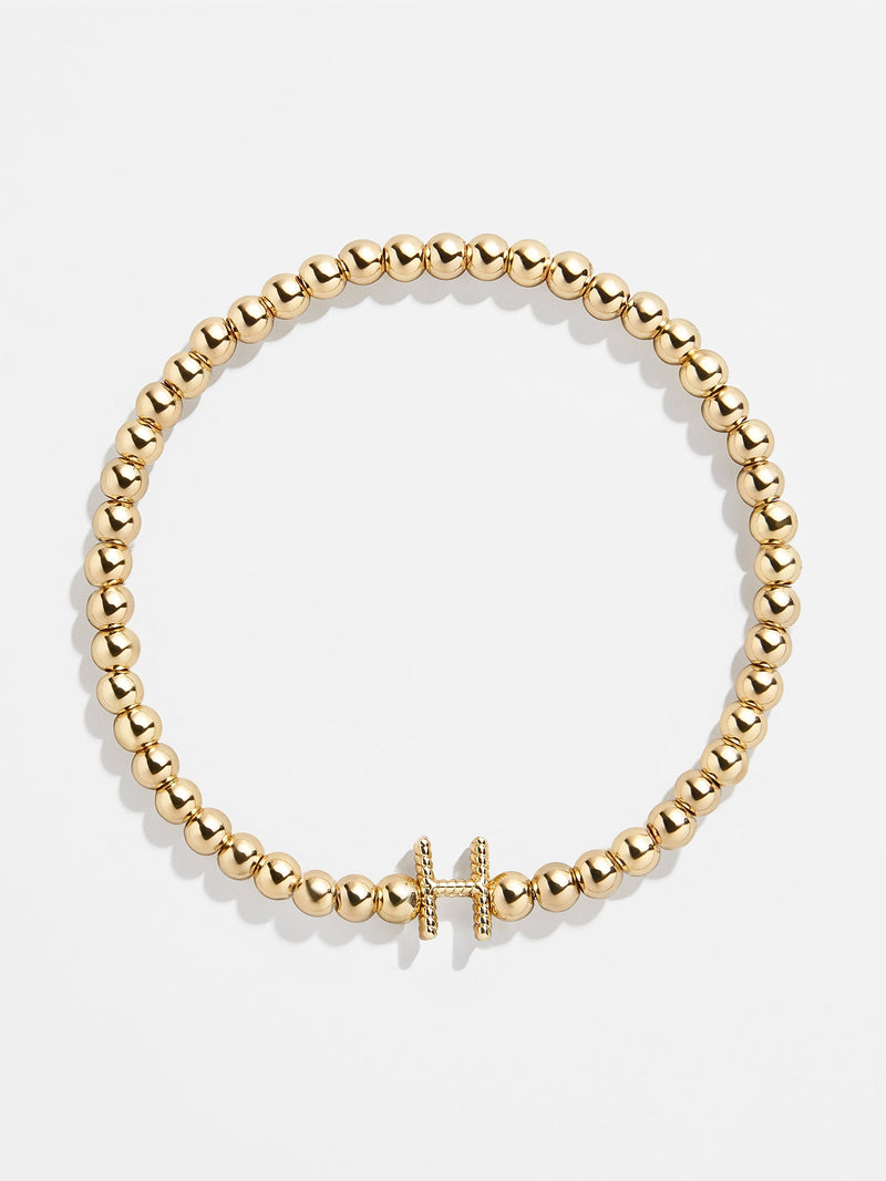 BaubleBar H - 
    Gold beaded stretch bracelet
  
