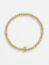 BaubleBar J - 
    Gold beaded stretch bracelet
  
