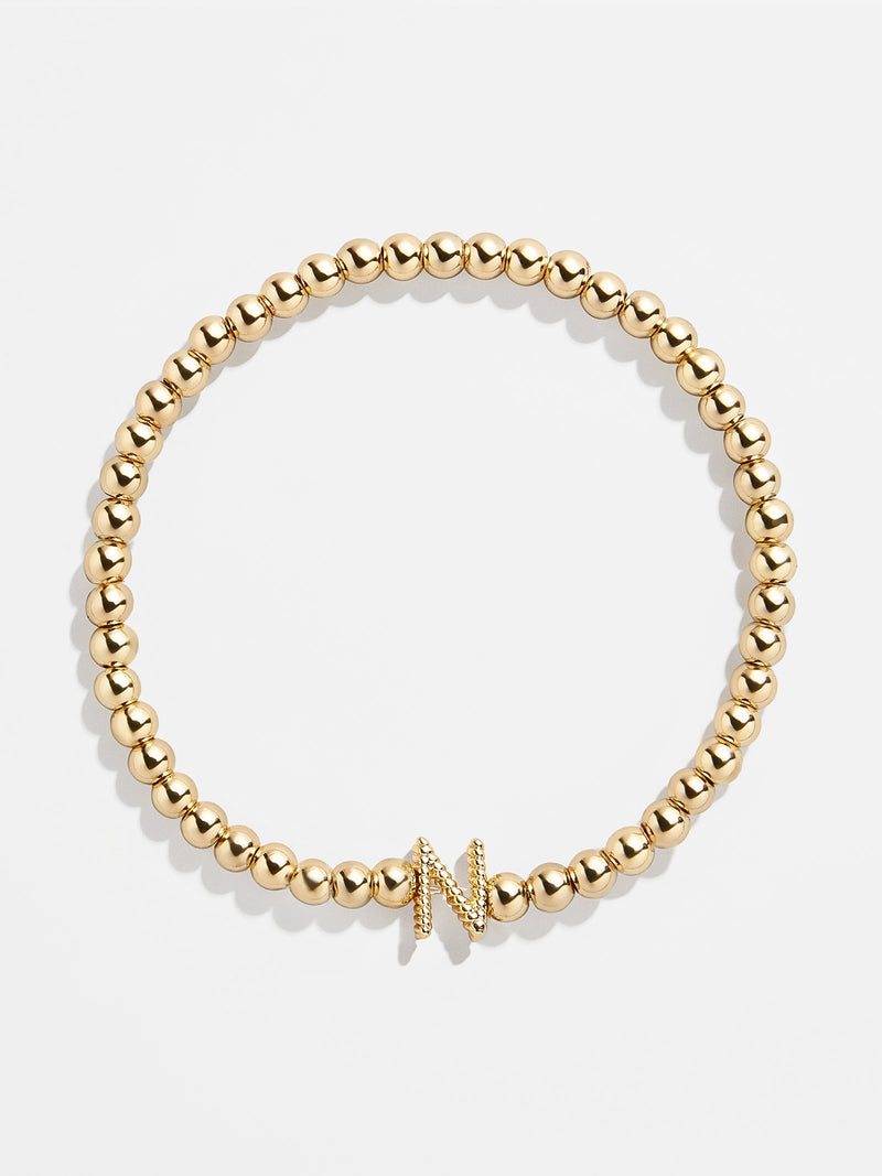 BaubleBar N - 
    Gold beaded stretch bracelet
  
