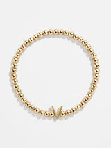 BaubleBar V - 
    Gold beaded stretch bracelet
  
