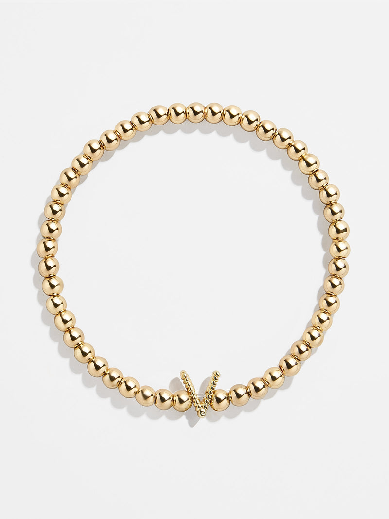BaubleBar V - 
    Gold beaded stretch bracelet
  
