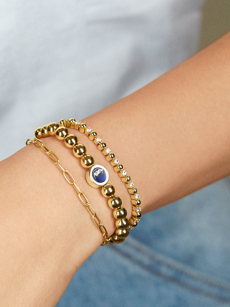 BaubleBar Dallas Mavericks Gold Pisa Bracelet - Dallas Mavericks - 
    NBA beaded stretch bracelet
  
