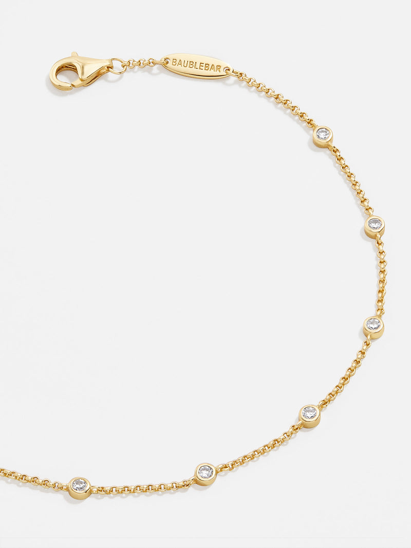 BaubleBar Yasmine 18K Gold Bracelet - Classic Bezel Stones - 
    18K Gold Plated Sterling Silver, Cubic Zirconia stones
  
