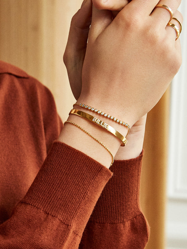 Iris Pisa Bracelet - Gold – Evil eye gold beaded stretch bracelet –  BaubleBar