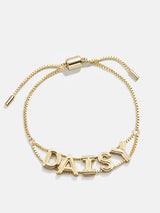 BaubleBar Custom Slider Bracelet - Etched Gold - 
    Custom slider nameplate bracelet
  
