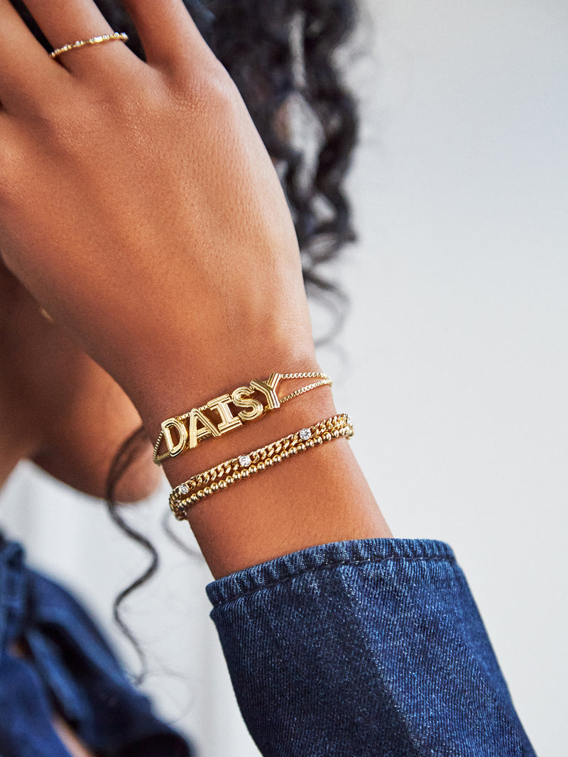 BaubleBar Custom Slider Bracelet - Etched Gold - 
    Custom slider nameplate bracelet
  
