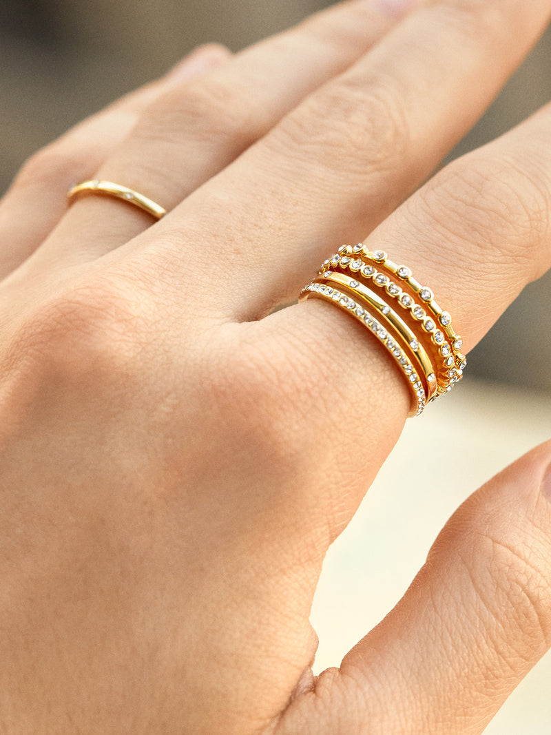 BaubleBar Morgan Ring Set - Clear/Gold - 
    Four gold stacking rings
  
